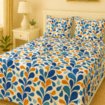 Blue and orange leaf print cotton bedsheet with pillow