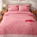 Pink floral printed bedsheet with coordinated pillow covers.